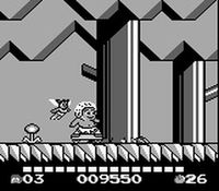 une photo d'Ã©cran de Adventure Island 2 - Aliens in Paradise sur Nintendo Game Boy